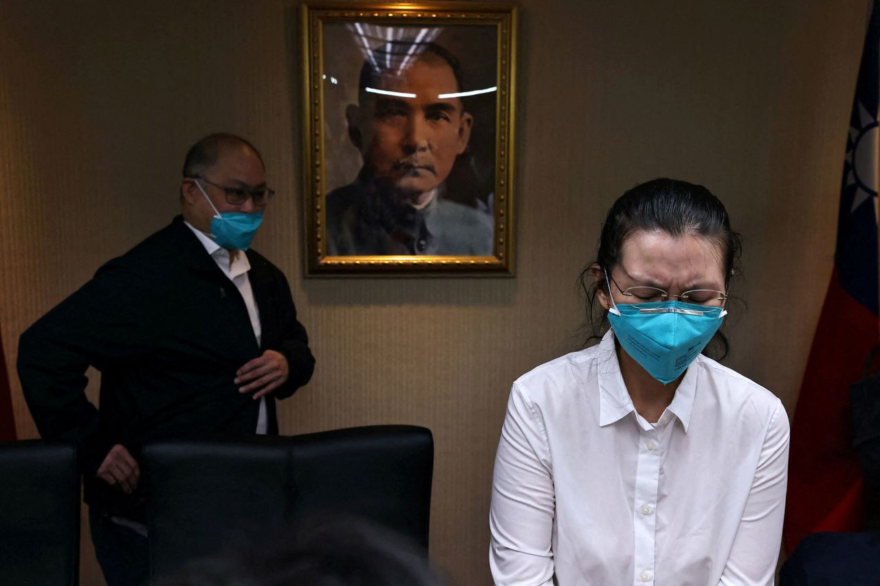 Taiwanese activist Li Ming-che and his wife, Li Ching-yu, react Tuesday, May 10, after speaking to the media for the first time since he was released from jail in China. He was serving five years on a sedition charge.