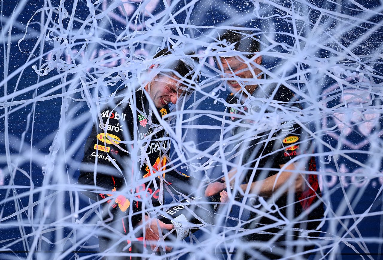 Formula One driver Max Verstappen, left, and engineer Ben Waterhouse celebrate on the podium after <a href="https://www.cnn.com/2022/05/09/motorsport/max-verstappen-miami-grand-prix-spt-intl/index.html" target="_blank">Verstappen won the inaugural Grand Prix of Miami</a> on Sunday, May 8.