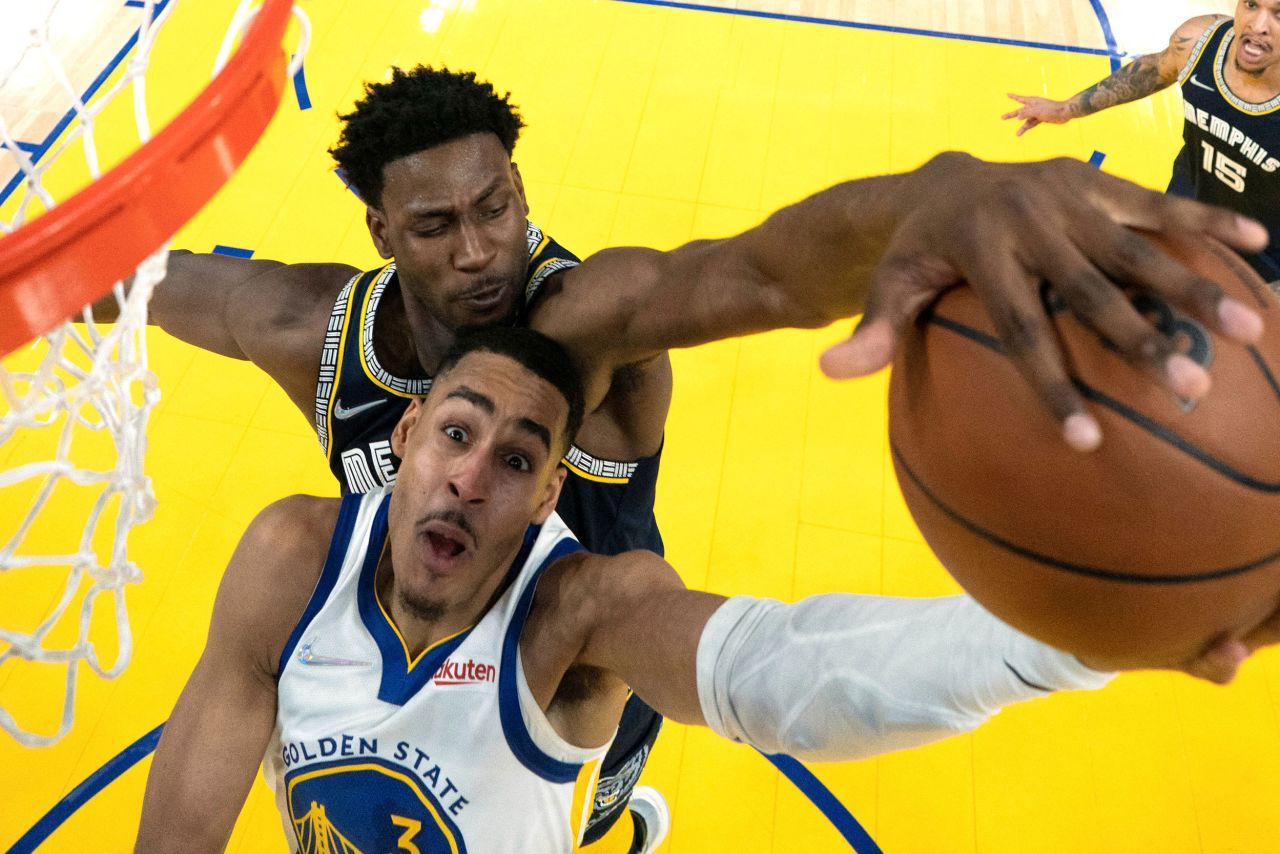 Memphis forward Jaren Jackson Jr. blocks Golden State guard Jordan Poole during an NBA playoff game on Monday, May 9.
