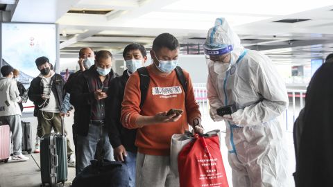 HUAI'AN, CHINA - MAY 11, 2022 - Epidemic prevention and control personnel check the travel information of passengers at a high-speed railway station in Huai 'an, Jiangsu Province, China, May 11, 2022. (Photo credit should read CFOTO/Future Publishing via Getty Images)