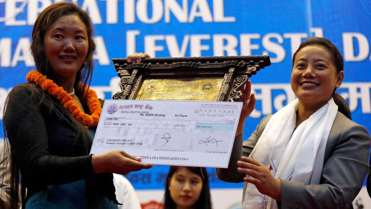 FILE PHOTO: Lhakpa Sherpa, 44, a Nepali mountaineer who climbed Mount Everest 9 times, receives Tenzing Ð Hillary Mountaineering Award during the function to mark the International Everest day in Kathmandu, Nepal May 29, 2018. REUTERS/Navesh Chitrakar/File Photo
