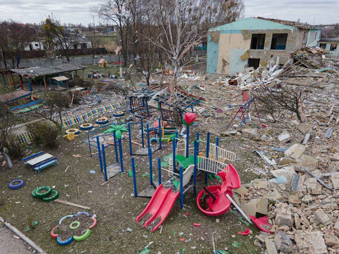 A damaged playground is seen next to the Barvinok kindergarten building in Makariv, Ukraine, on April 19.