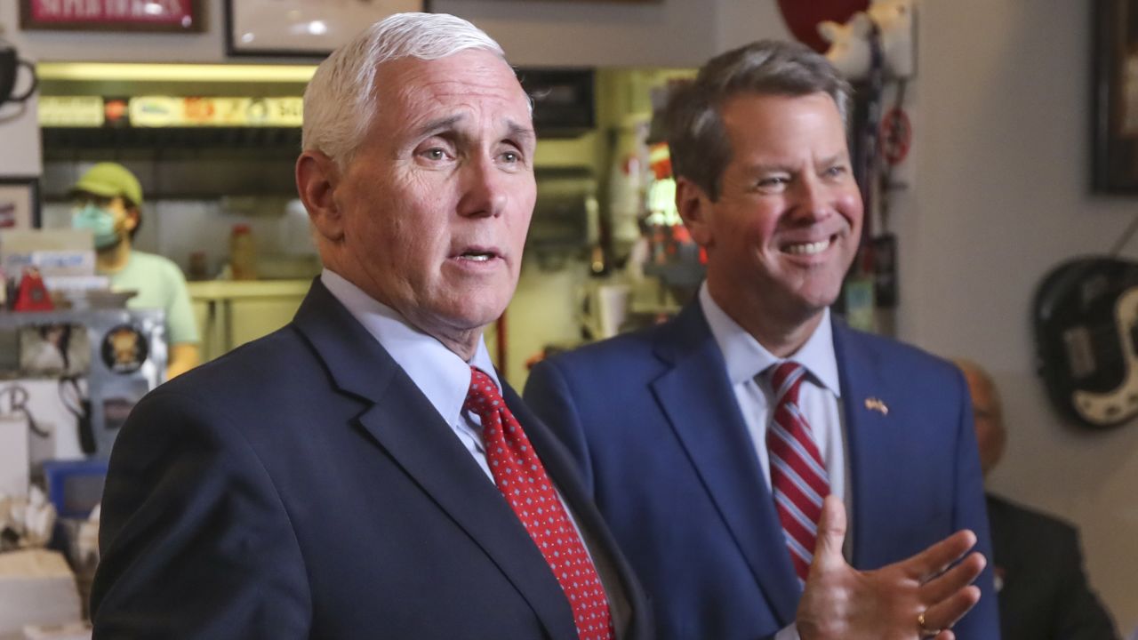 Vice President Mike Pence, left, speaks as Georgia Gov. Brian Kemp, right, listens at the Star Cafe in Atlanta, Friday, May 22, 2020, during the coronavirus pandemic. (John Spink/Atlanta Journal-Constitution via AP)
