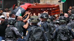 Violence erupts between Israeli security forces and Palestinian mourners carrying the casket of slain  Al-Jazeera journalist Shireen Abu Akle out of a hospital, before being transported to a church and then her resting place, in Jerusalem, on May 13.