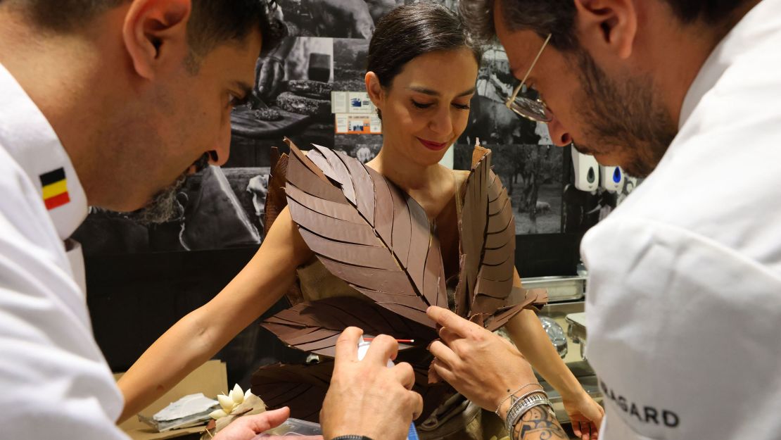 Chocolatiers add the last touches to a dress made of chocolate, during a fashion show at the first Salon du Chocolat Dubai fair, organized in the emirate, on May 12. 