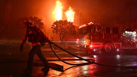 Firefighters battle the Coastal fire at Coronado Pointe in Laguna Niguel, California, on May 11.
