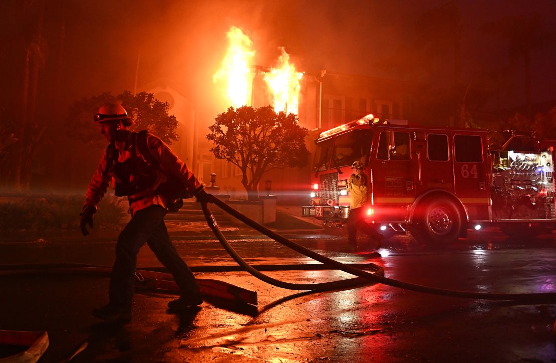 Firefighters battle the Coastal fire at Coronado Pointe in Laguna Niguel, California, on May 11.