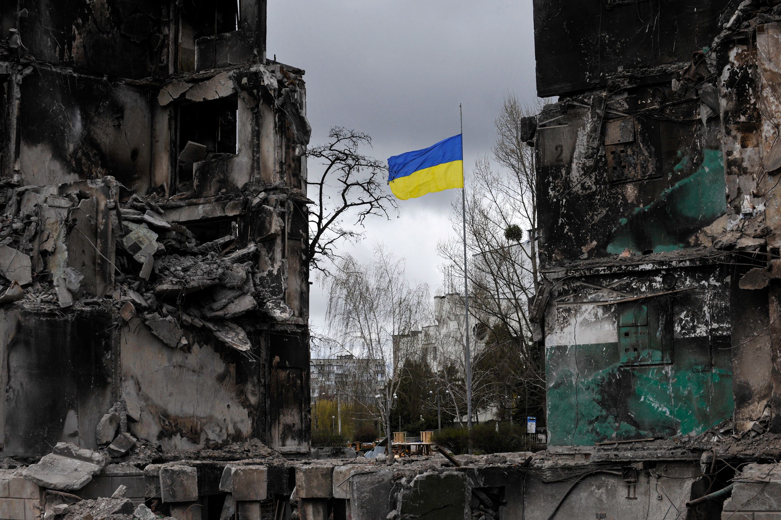 A Ukrainian flag flys in a damaged residential area in the city of Borodianka, northwest of the Ukrainian capital Kyiv. In Borodyanka in the Kiev region, rescuers pulled out the bodies of 41 dead from under the rubble. This was reported by the press center of the State Service of Ukraine for Emergency Situations. Russia invaded Ukraine on 24 February 2022, triggering the largest military attack in Europe since World War II. (Photo by Sergei Chuzavkov/SOPA Images/Sipa USA)No Use Germany.