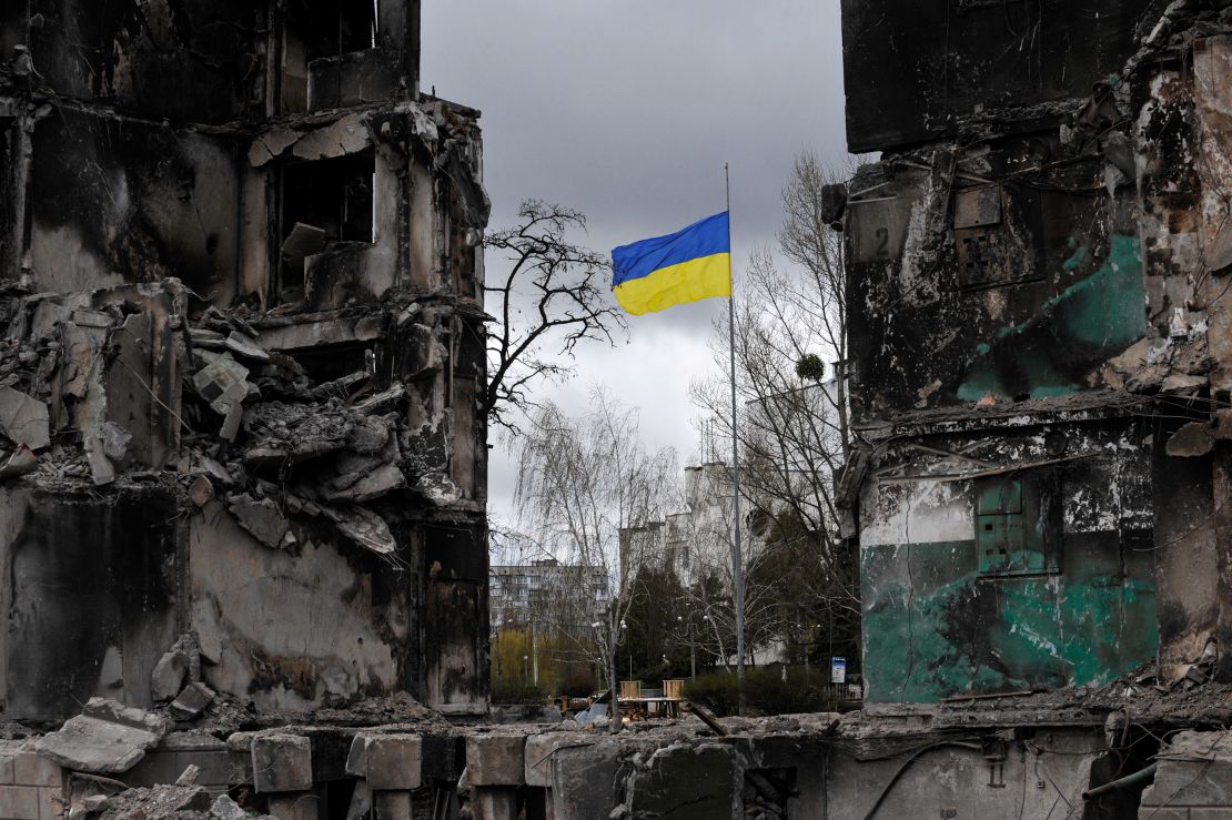 A Ukrainian flag flies in a damaged residential area in the city of Borodianka, northwest of the Ukrainian capital, Kyiv.