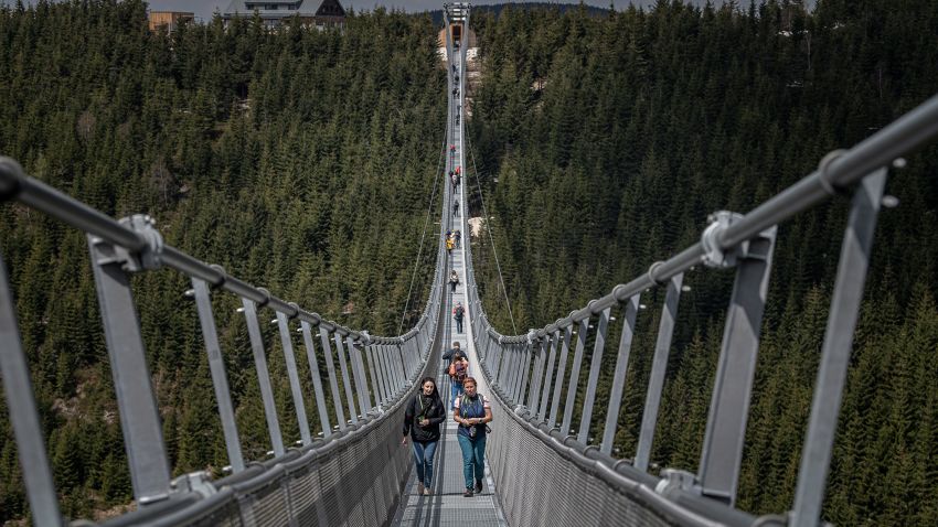 DOLNI MORAVA, CZECH REPUBLIC - MAY 9: Visitors walk on the Sky Bridge 721, the world's longest suspension pedestrian bridge in Dolni Morava, Czech Republic on May 9, 2022. Sky Bridge 721, the longest pedestrian bridge in the world with a length of 721 meters and an elevation of 95 meters above the ground, is located in the Pardubice region (a break between the Eagle Mountains and the Jesenice). (Photo by Lukas Kabon/Anadolu Agency via Getty Images)