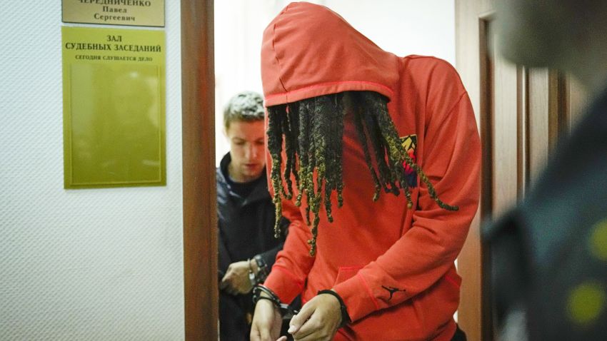 WNBA star and two-time Olympic gold medalist Brittney Griner leaves a courtroom after a hearing, in Khimki just outside Moscow, Russia, Friday, May 13, 2022. Griner, a two-time Olympic gold medalist, was detained at the Moscow airport in February after vape cartridges containing oil derived from cannabis were allegedly found in her luggage, which could carry a maximum penalty of 10 years in prison.  (AP Photo/Alexander Zemlianichenko)