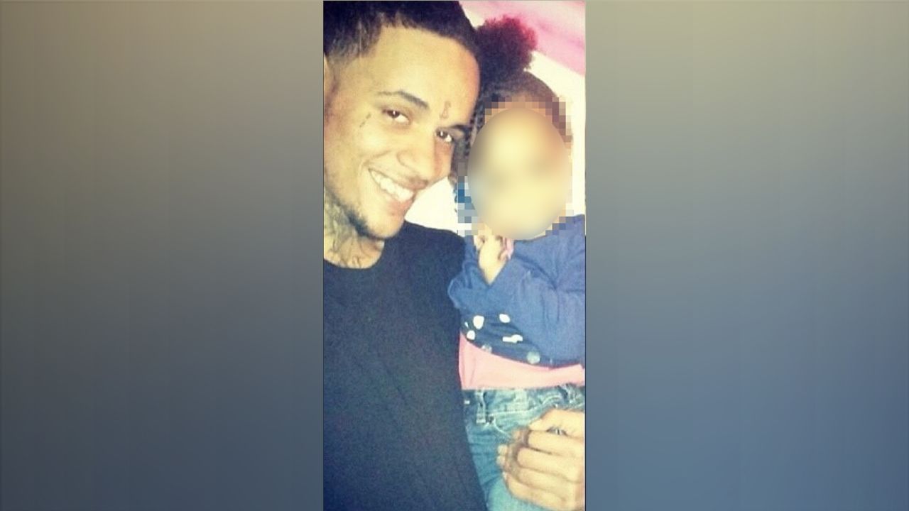 An image of Xavier Ingram before his encounter with police on June 12, 2014.  Parts of this image were obscured to protect the identity of the child. 