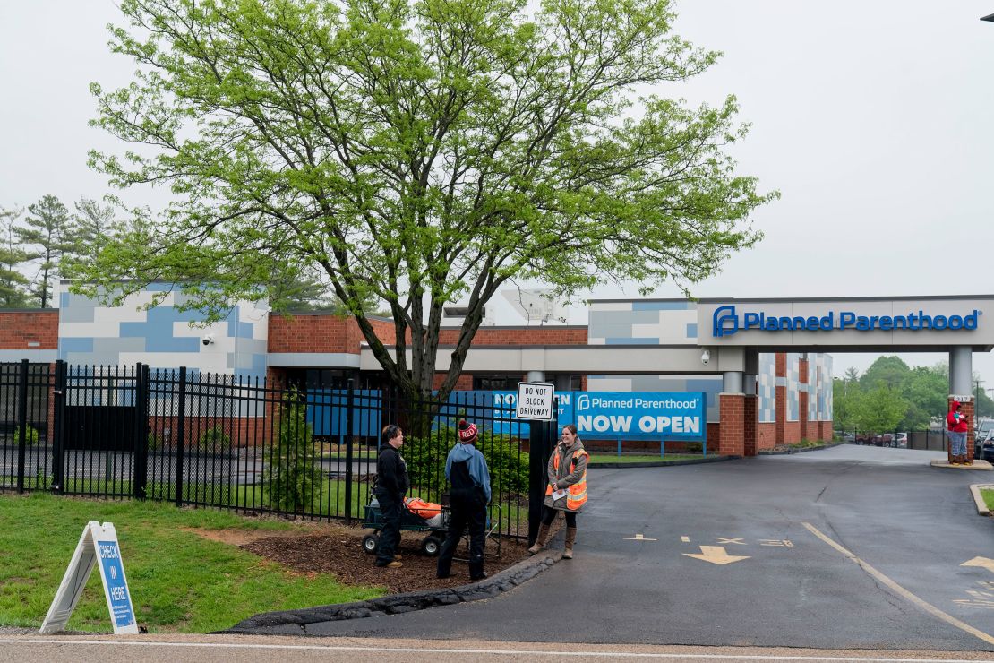 People representing Coalition for Life stand outside the Planned Parenthood clinic in Fairview Heights on Thursday, May 5.