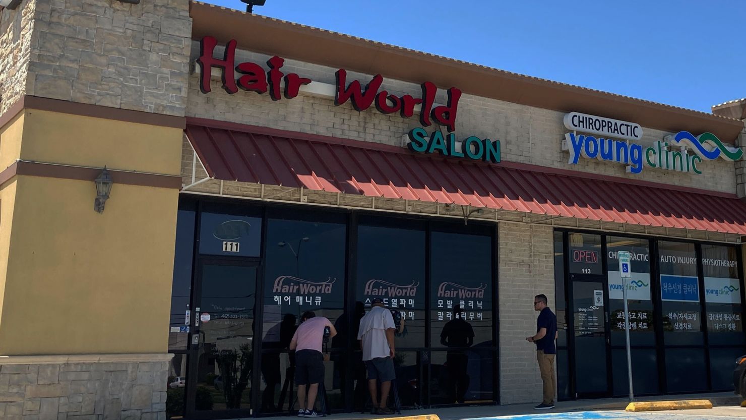 This photo shows the exterior of Hair World Salon in Dallas, where police say Wednesday's shooting took place. 