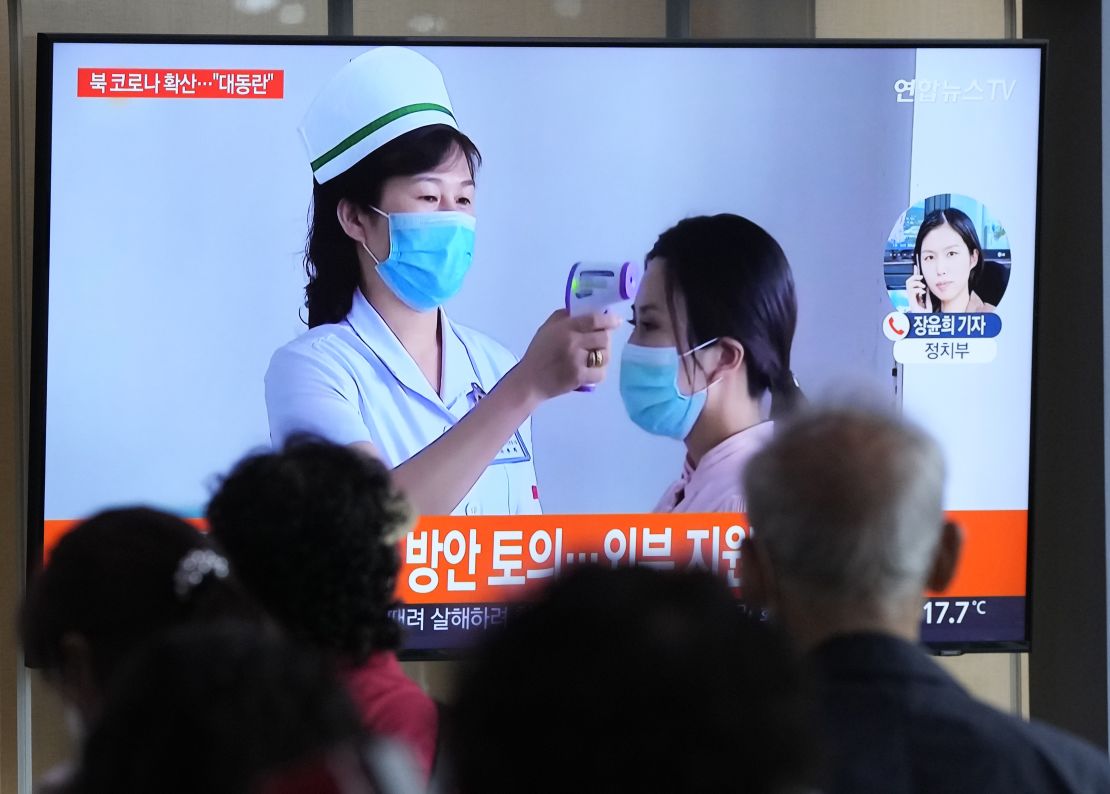 People in Seoul, South Korea, watch a news report on TV about the Covid-19 outbreak in North Korea on May 14.