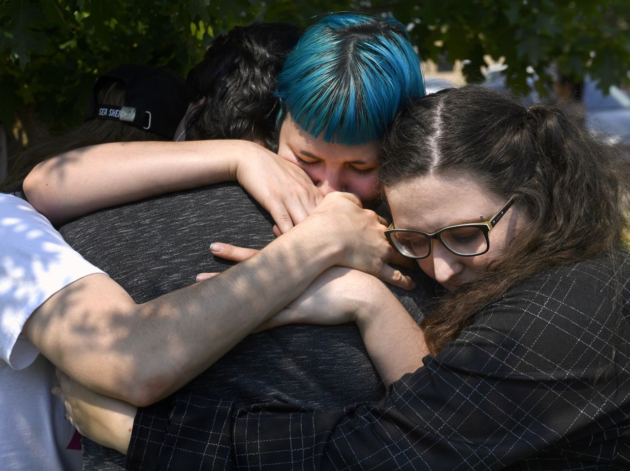 Nyx Eros, center, and others hug Alyx Rivera during an abortion rights protest outside of Abilene City Hall in Texas.