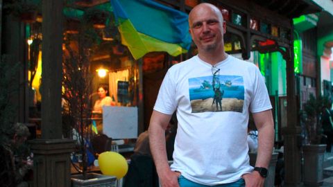 Max Tolmachov stands in front of his bar in Kyiv on Saturday, May 14.