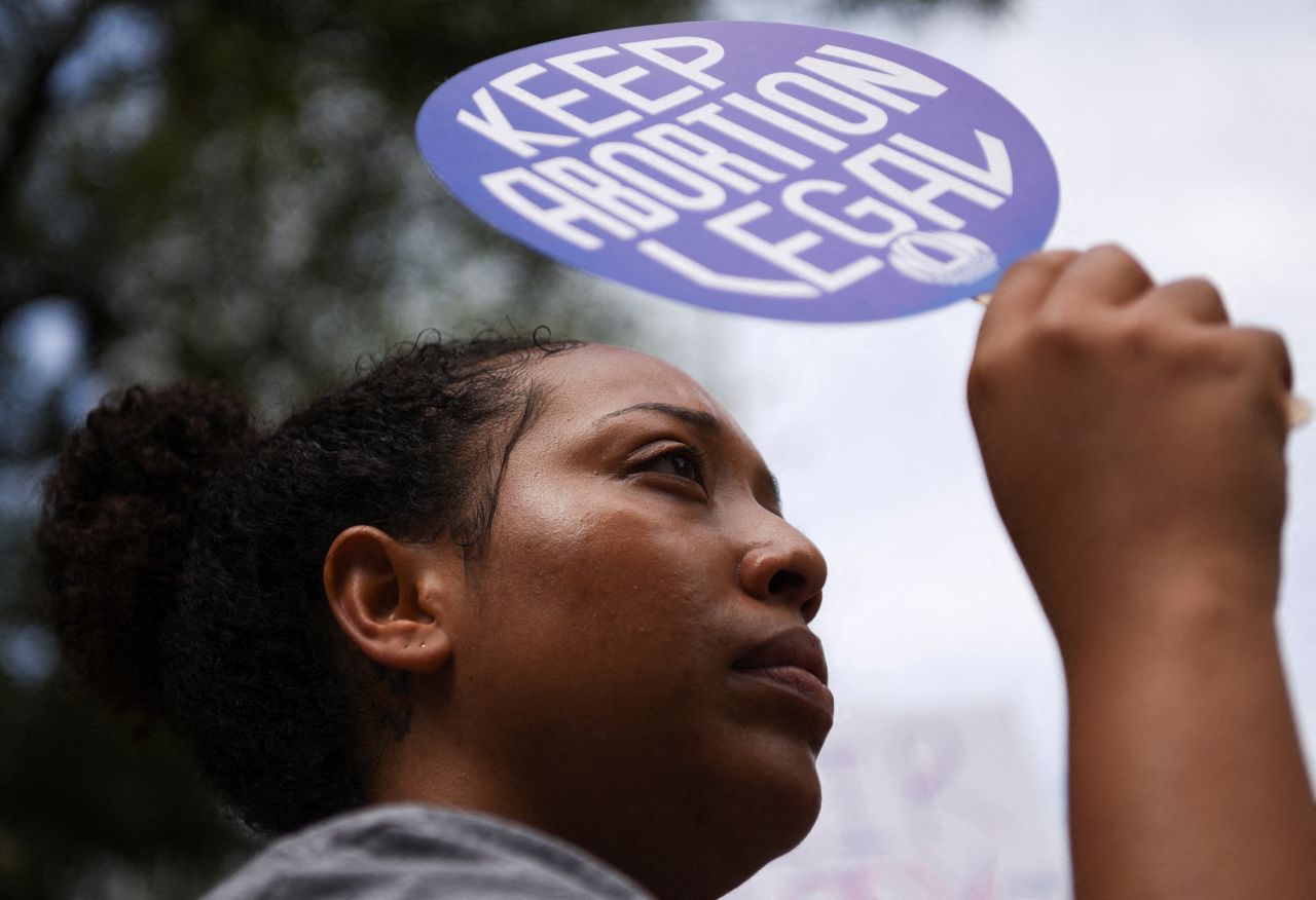 A protester holds up a sign during a demonstration in Houston.
