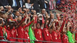 LONDON, ENGLAND - MAY 14: Jordan Henderson of Liverpool lifts The FA Cup trophy after their sides victory during The FA Cup Final match between Chelsea and Liverpool at Wembley Stadium on May 14, 2022 in London, England. (Photo by Mike Hewitt/Getty Images)