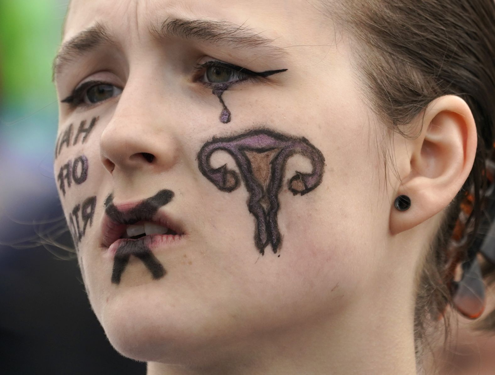 Auriea Moore listens to speakers at a rally for abortion rights in Seattle. 