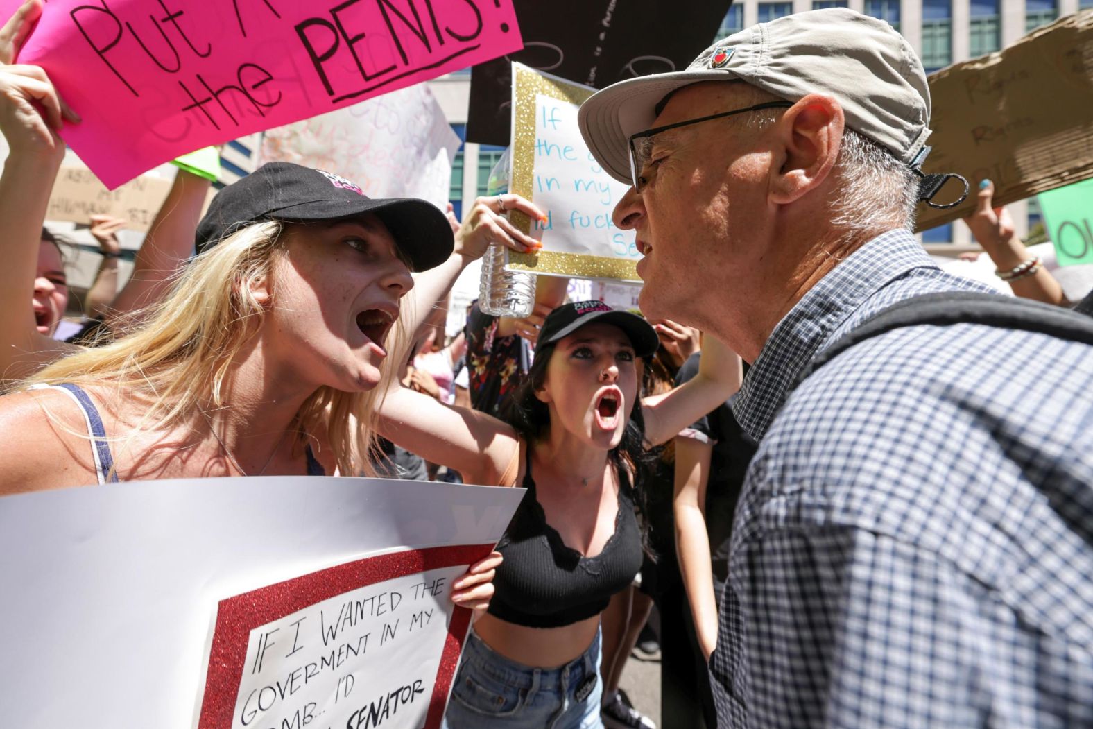 Abortion rights proponents argue with an anti-abortion activist during a rally in San Diego.