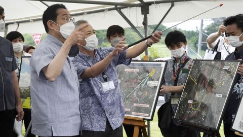 Japanese Prime Minister Fumio Kishida, left, visits the US military's Camp Foster in Okinawa on May 15, 2022, the 50th anniversary of the southern island prefecture's reversion to Japan from US rule.