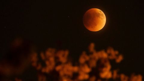 The moon glows red over Columbus, Ohio on Sunday. 
