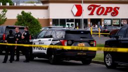 Police officers secure the scene after a shooting at a supermarket in Buffalo, New York, on May 14, 2022. 