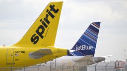 Spirit Airlines and JetBlue Airways passenger planes sit parked next to each other at Orlando International Airport during a new coronavirus pandemic, Wednesday, April 20, 2022, in Orlando, Fla. (Phelan M. Ebenhack via AP)