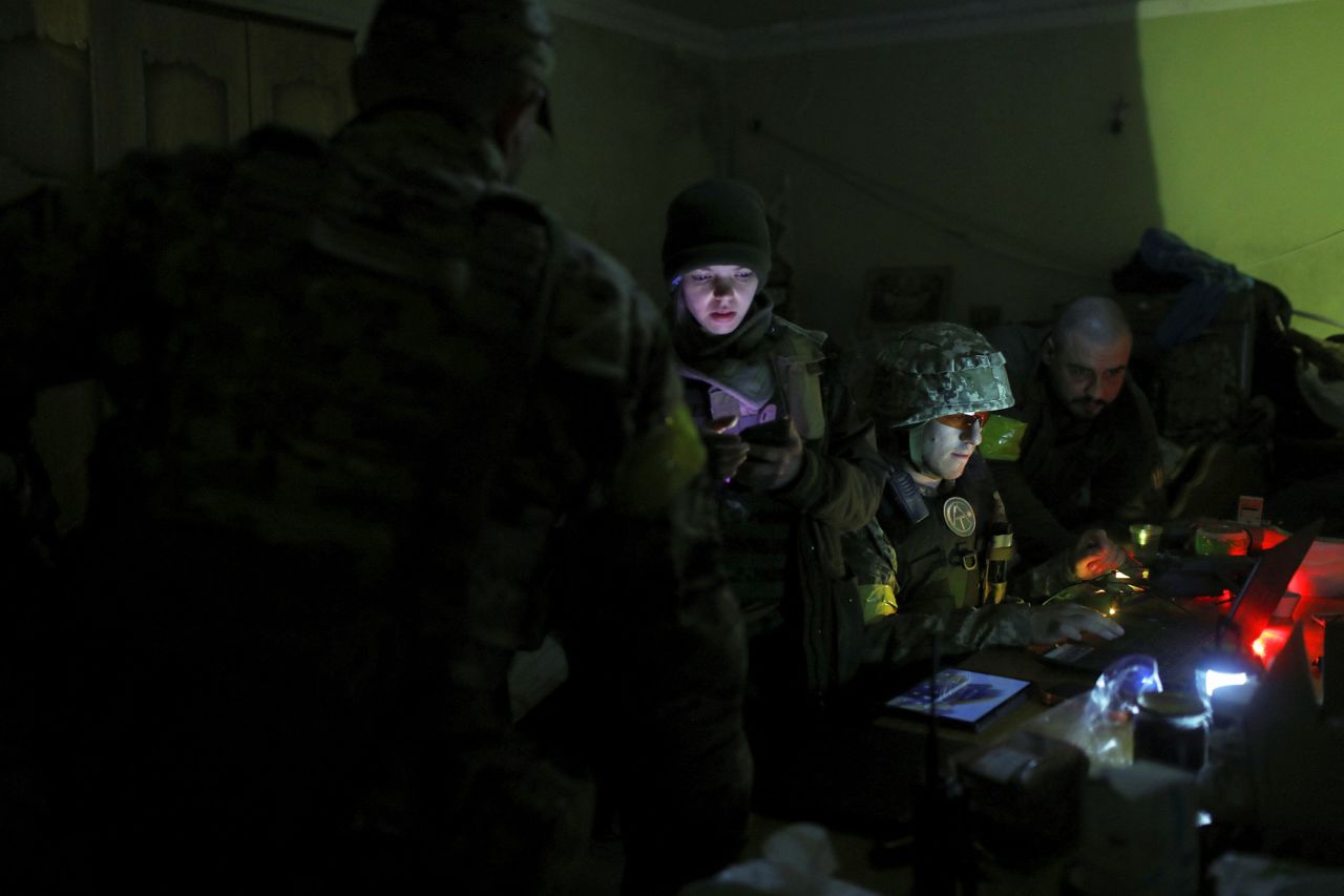 Ukrainian service personnel work inside a basement used as a command post in the Kharkiv region on May 15.