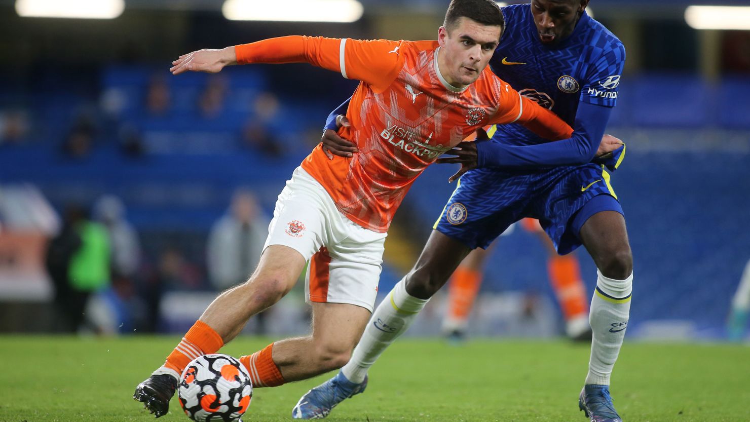 Jake Daniels shields the ball from Chelsea' s Luke Badley Morgan during Chelsea Under-18 vs. Blackpool Under-18 in the FA Youth Cup.