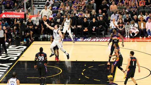 Doncic lays up a shot against the Suns.