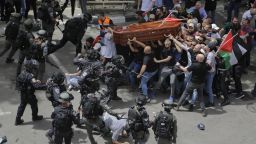 FILE - Israeli police confront mourners as they carry the casket of slain Al Jazeera veteran journalist Shireen Abu Akleh during her funeral in east Jerusalem, Friday, May 13, 2022. Latin Patriarch Pierbattista Pizzaballa, the top Catholic clergyman in the Holy Land, told reporters at St. Joseph Hospital in Jerusalem on Monday that the police beating mourners as they carried Shireen Abu Akleh's her casket was a disproportionate use of force that "disrespected" the Catholic Church. He added that Israel committed a "severe violation" of international norms. (AP Photo/Maya Levin, File)