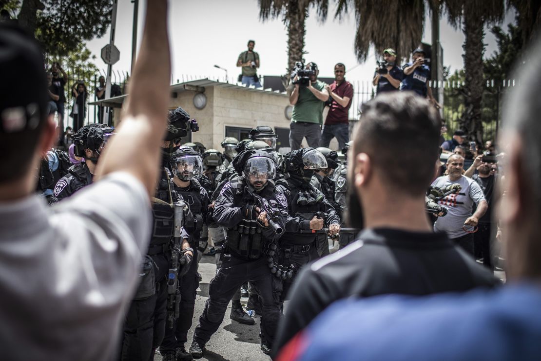 Israeli border police pictured during the funeral on Friday.