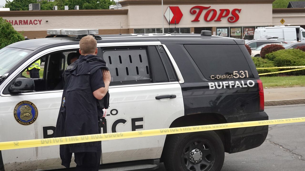 BUFFALO, NEW YORK - MAY 16: Police and FBI agents continue their investigation of the shooting at Tops Market on May 16, 2022 in Buffalo, New York. A gunman opened fire at the store yesterday killing ten people and wounding another three. The attack was believed to be motivated by racial hatred.  (Photo by Scott Olson/Getty Images)