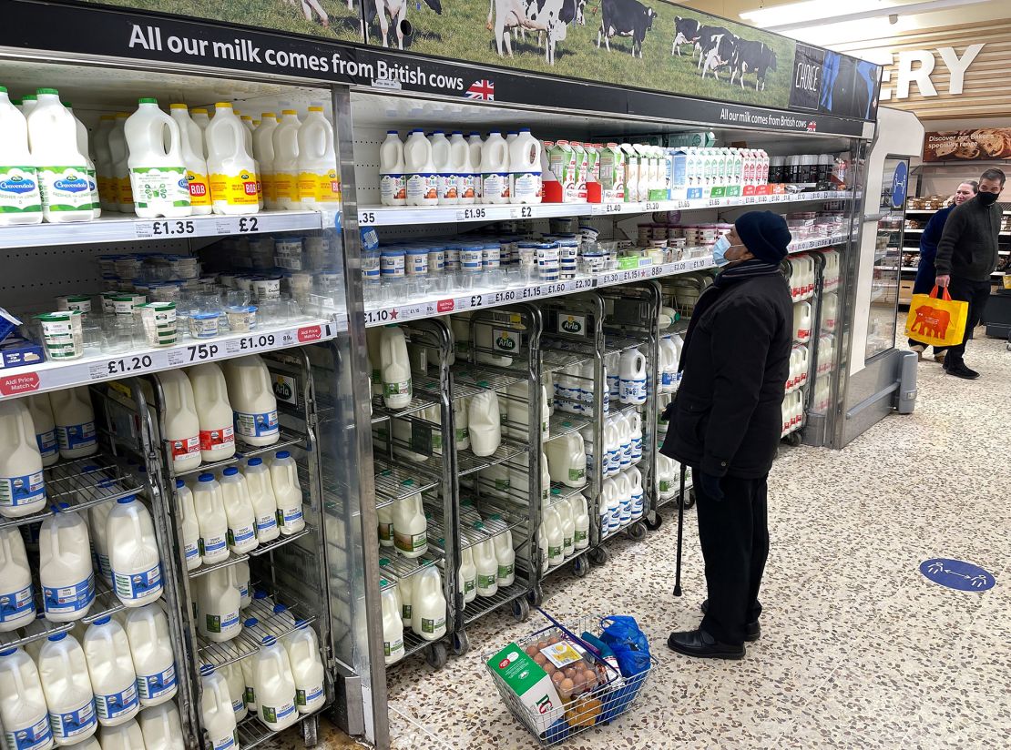 A customer shops for food items inside a Tesco supermarket store in east London.