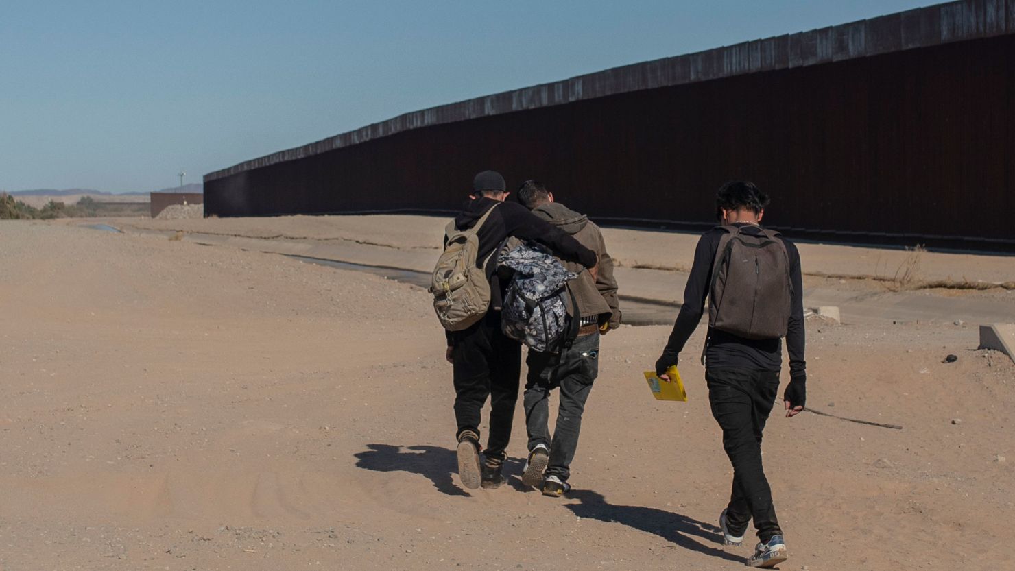 Nicaraguan migrants walk on the US-Mexico border, in Algodones, Baja California, Mexico, December 2, 2021. 
