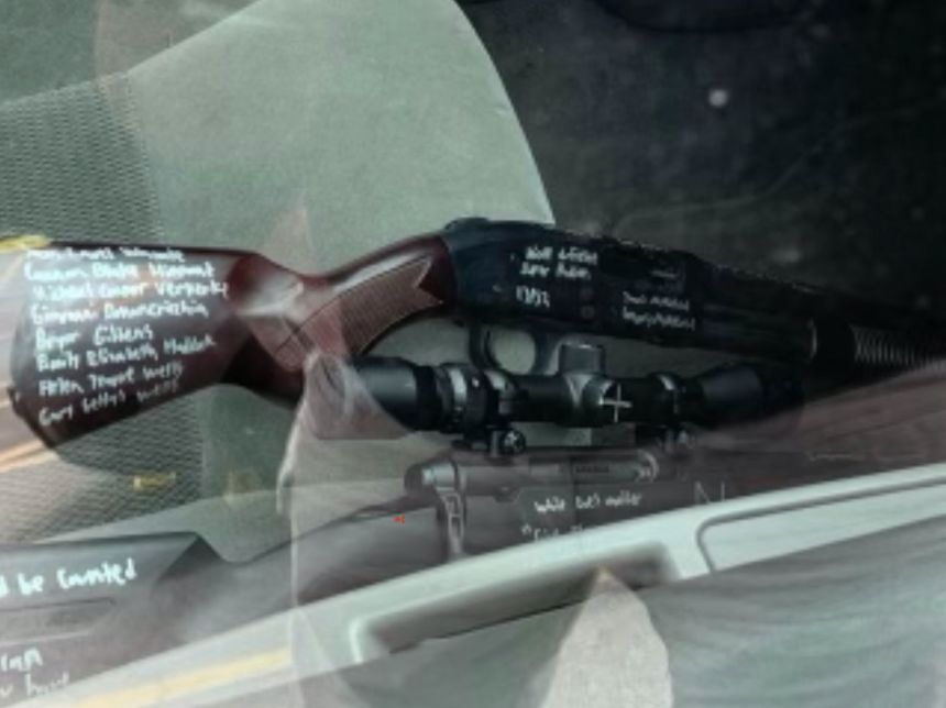 A photo of two long guns, not used in the shooting, were allegedly found in the Buffalo shooting suspect's car with writing all over them, according to law enforcement sources.
