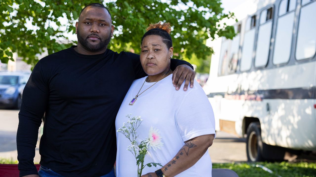 Calvin Albrow and Raqueal "RaRa" Watson pose for a portrait outside the supermarket.