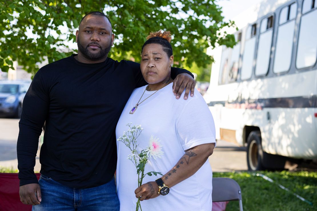 Calvin Albrow and Raqueal "RaRa" Watson pose for a portrait outside the supermarket.