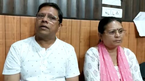 Sanjeev and Sadhana Prasad at a lawyer's chamber in Haridwar, India, on May 12.