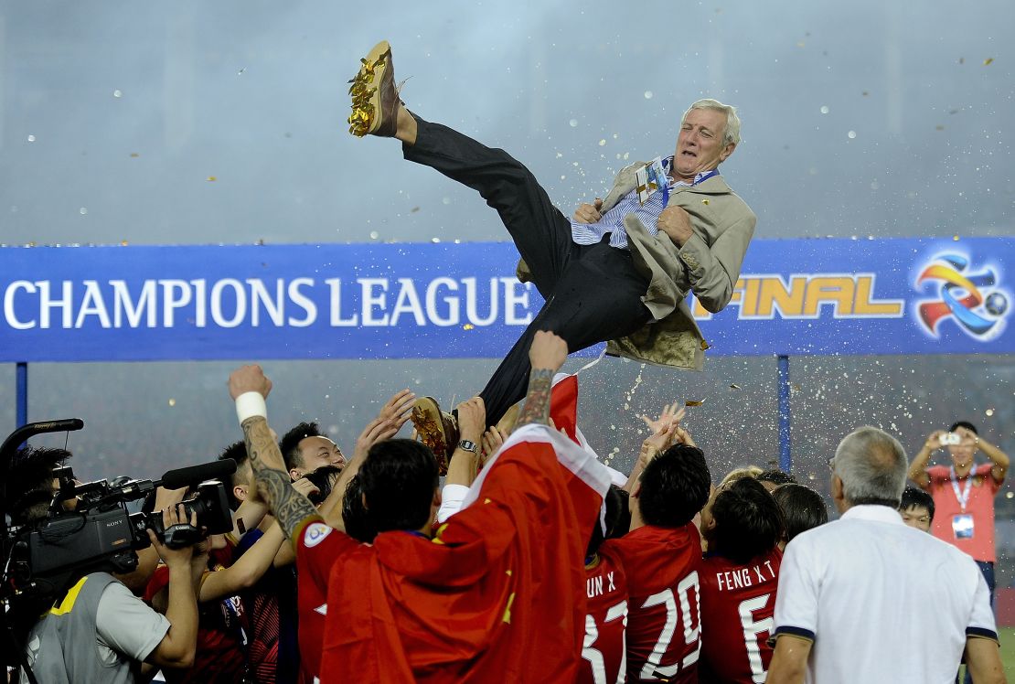 Guangzhou Evergrande players throw their coach Marcello Lippi into the air after winning the 2013 Asian Champions League final.