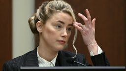 US actress Amber Heard testifies in the courtroom at the Fairfax County Circuit Courthouse in Fairfax, Virginia, May 17, 2022. - Actor Johnny Depp is suing ex-wife Amber Heard for libel after she wrote an op-ed piece in The Washington Post in 2018 referring to herself as a public figure representing domestic abuse. (Photo by BRENDAN SMIALOWSKI / POOL / AFP) (Photo by BRENDAN SMIALOWSKI/POOL/AFP via Getty Images)