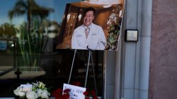 A photo of Dr. John Cheng, a 52-year-old victim who was killed in Sunday's shooting at Geneva Presbyterian Church, is displayed outside his office in Aliso Viejo, Calif., Monday, May 16, 2022. Authorities say a Chinese-born gunman was motivated by hatred against Taiwan when he chained shut the doors of the church and hid firebombs before shooting at a gathering of mainly of elderly Taiwanese parishioners. (AP Photo/Jae C. Hong)