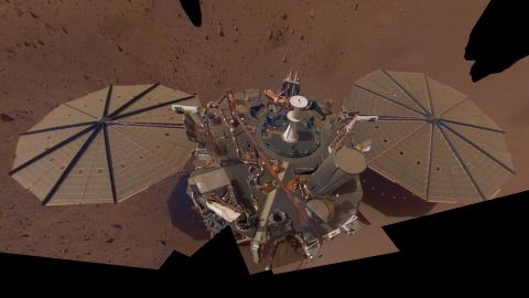     InSight's second full selfie, made up of multiple images taken in March and April 2019, shows dust accumulating on the solar panels.