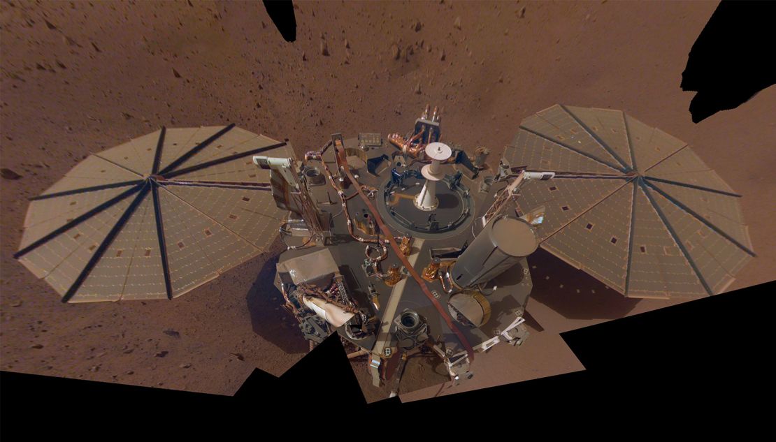 A selfie captured by InSight shows a buildup of dust on its solar panels in 2019.