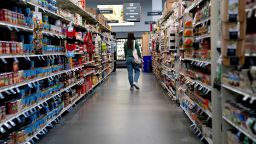 A shopper through a grocery store in Washington, DC, on April 12, 2022. 