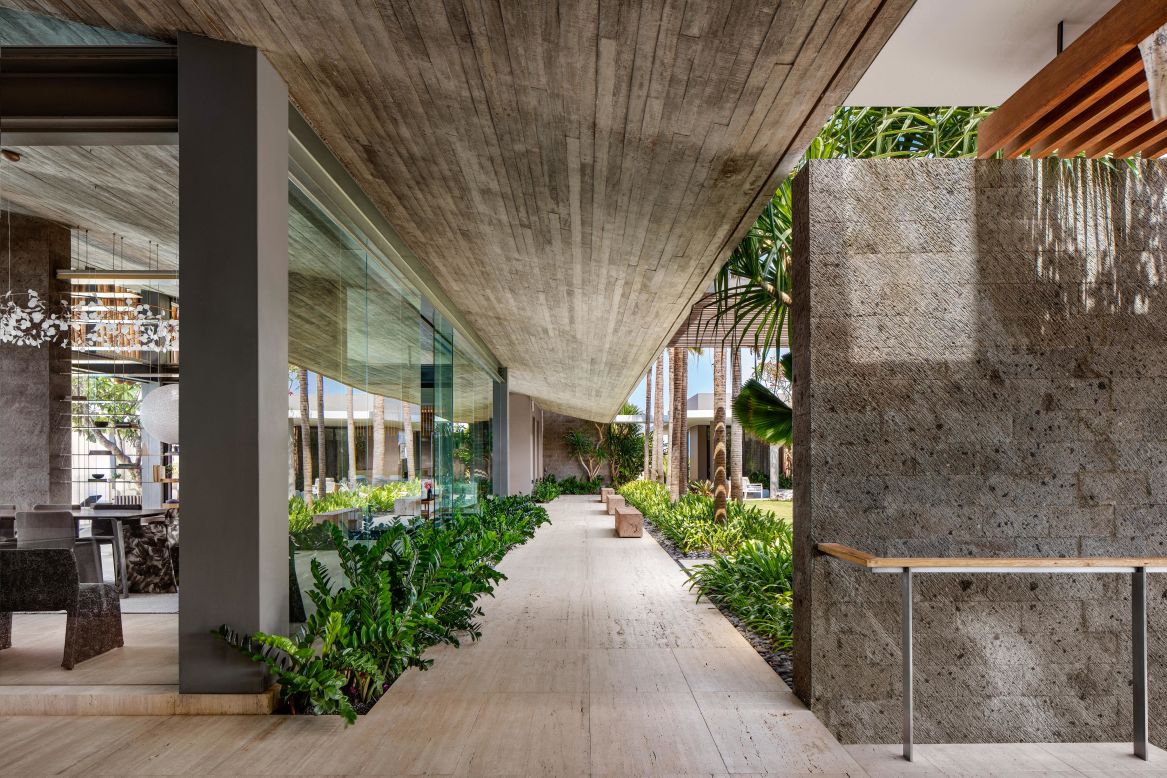 <strong>"Uluwatu" -- </strong>The residence, completed in 2018, features plenty of sheltered outdoor spaces ideal for the tropical climate. Raw concrete and treated timber are prevalent, with sea views from the master bedroom.