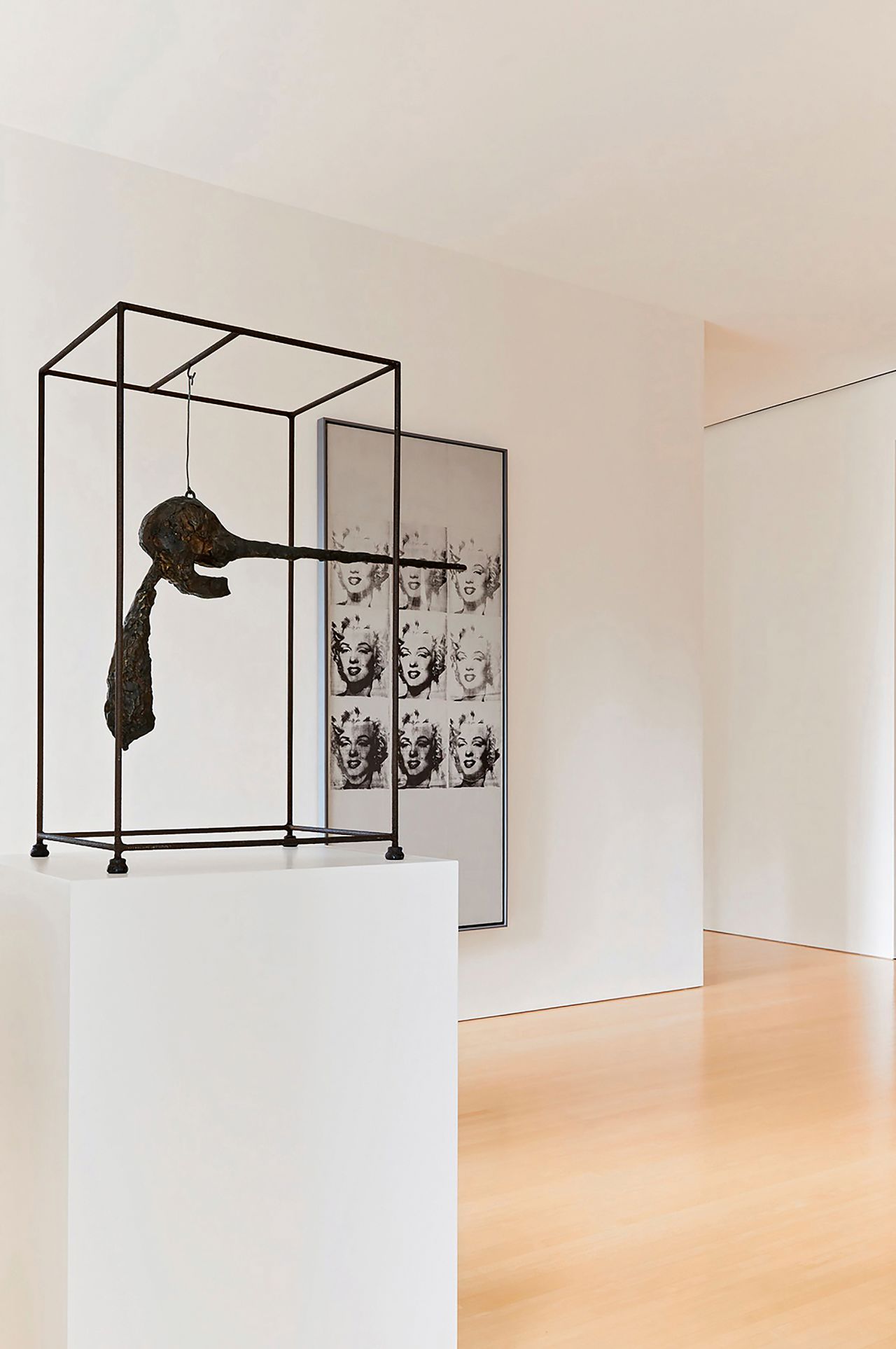 Giacometti's "Le Nez" (left) sold for $78.4 million, while Andy Warhol's "Nine Marilyns" (right) fetched $47.4 million in the first auction.