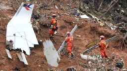 Rescuers conduct search and rescue work at a plane crash site in Tengxian County, south China's Guangxi Zhuang Autonomous Region, March 24, 2022.  Pieces of engine wreckage of the passenger plane that crashed in south China's Guangxi earlier this week have been found, an official told a press briefing on Thursday.  As of 4 p.m. Thursday, a total of 183 pieces of aircraft wreckage, some remains of victims and 21 pieces of belongings of victims have been found and handed over to the investigation team, Zheng said.    The plane with 132 aboard crashed on the afternoon of March 21 in a village in Guangxi's Tengxian County. No survivors have been found so far. One black box of the plane has been recovered. (Photo by Lu Boan/Xinhua via Getty Images)